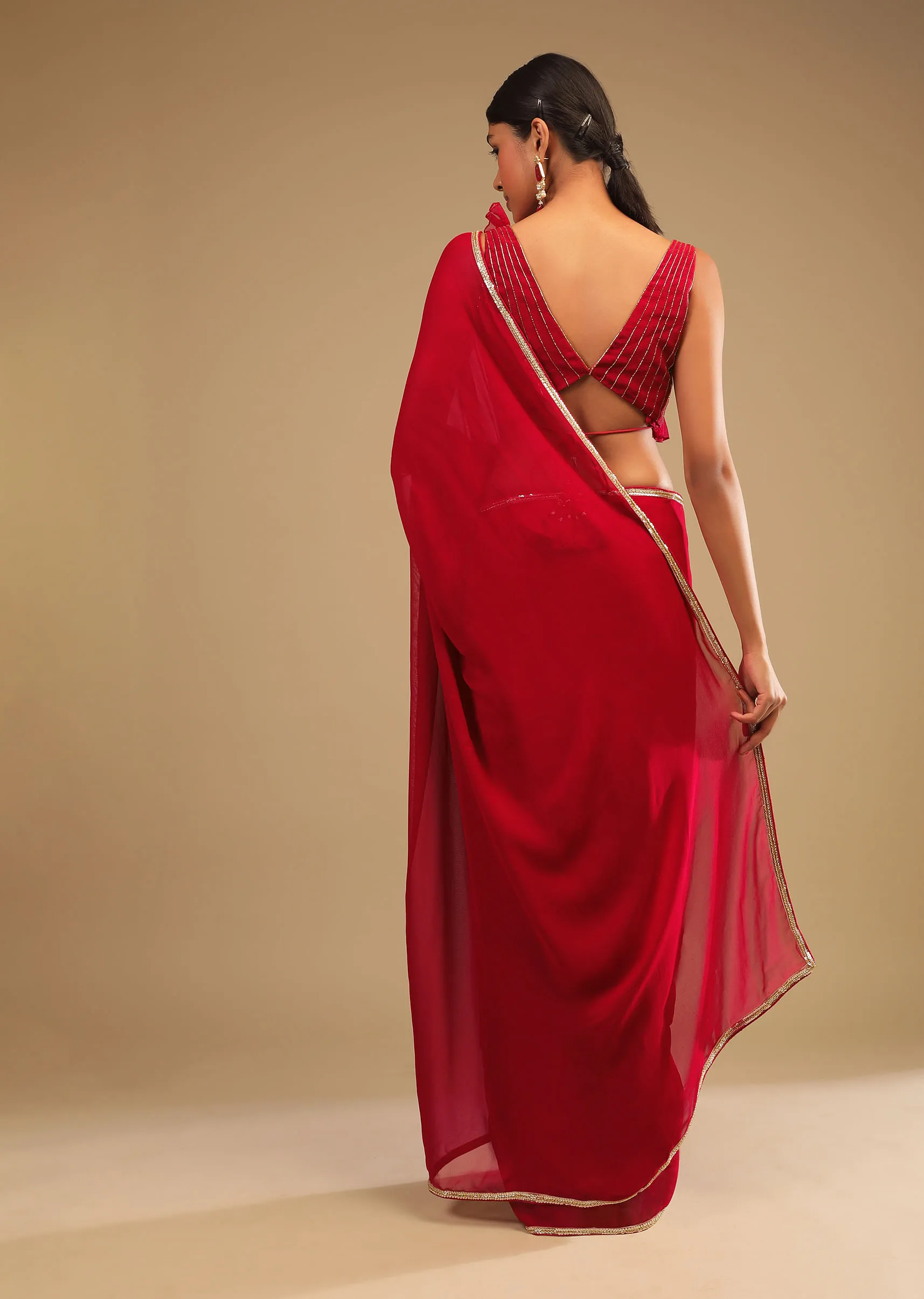 Cherry Red Saree In Georgette With Sequins And Cut Dana Embellished Border And A Ruffle Frill Adorned Crop Top 