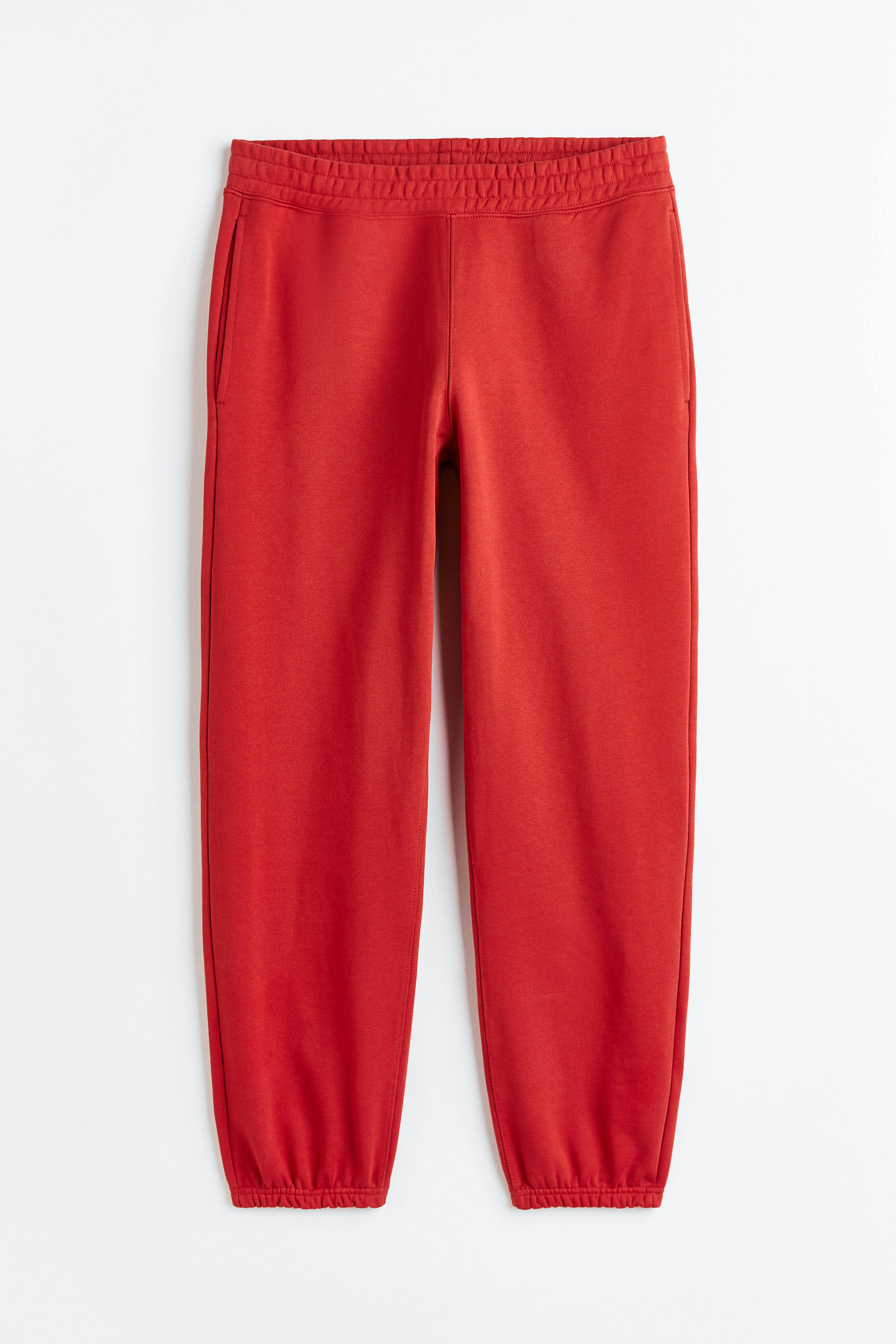 Relaxed Fit Cotton joggers - Regular waist - Long - Crimson red - Men | H&M GB