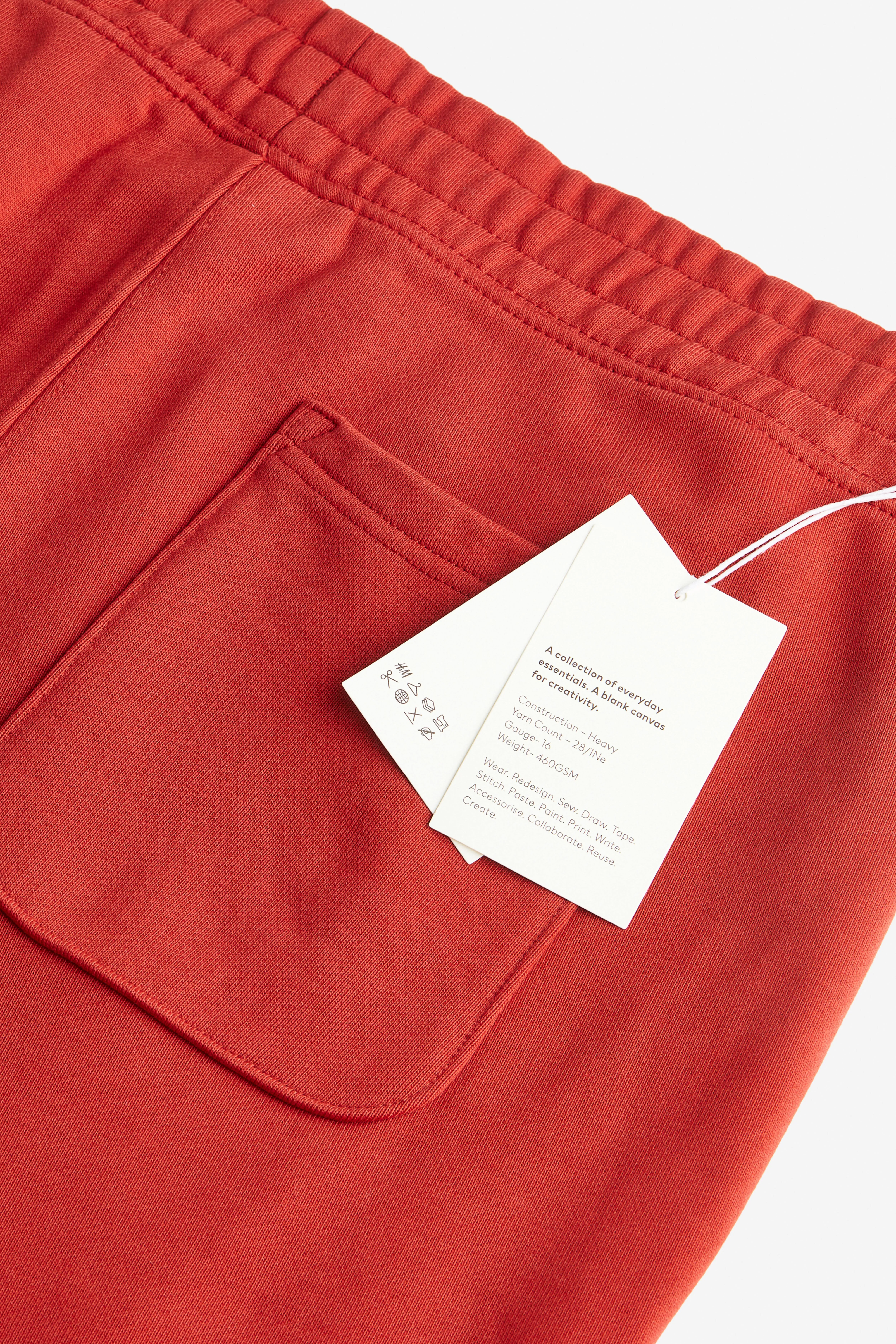 Relaxed Fit Cotton joggers - Regular waist - Long - Crimson red - Men | H&M GB